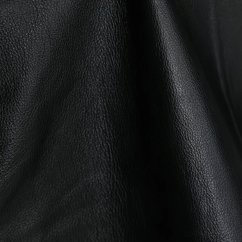 Detail of black leather gothic vest's decorative chain straps and side panel construction, highlighting industrial goth aesthetic elements