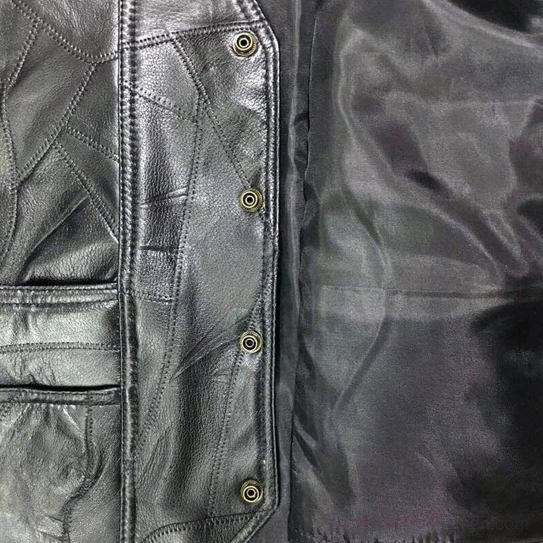 Double front pocket and adjustable side lace construction on black gothic leather vest
