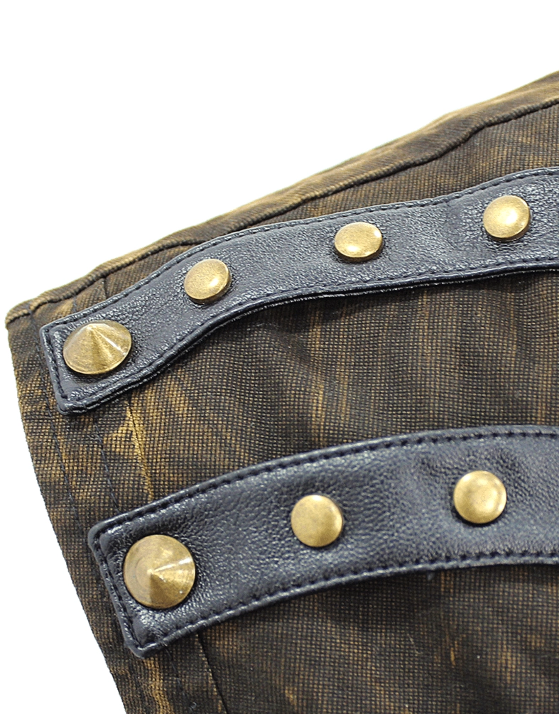 Close-up detail of leather shoulder straps with brass round studs and hardware accent