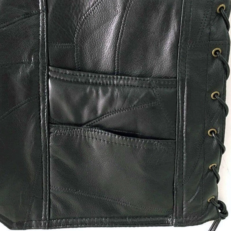 Black side lace-up panel with metal eyelet fasteners on gothic leather biker vest