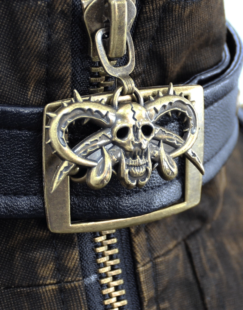 Detailed close-up of skull-shaped brass buckle and metal zipper on gothic biker vest