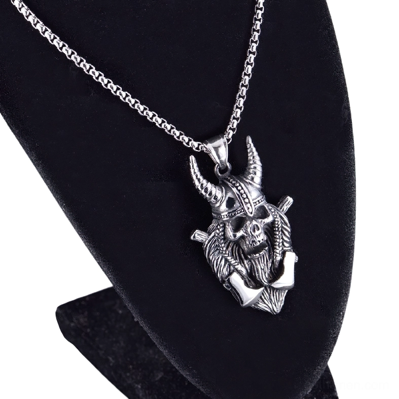 Viking warrior skull pendant on display - hanging on black velvet jewelry stand - gothic necklace styling