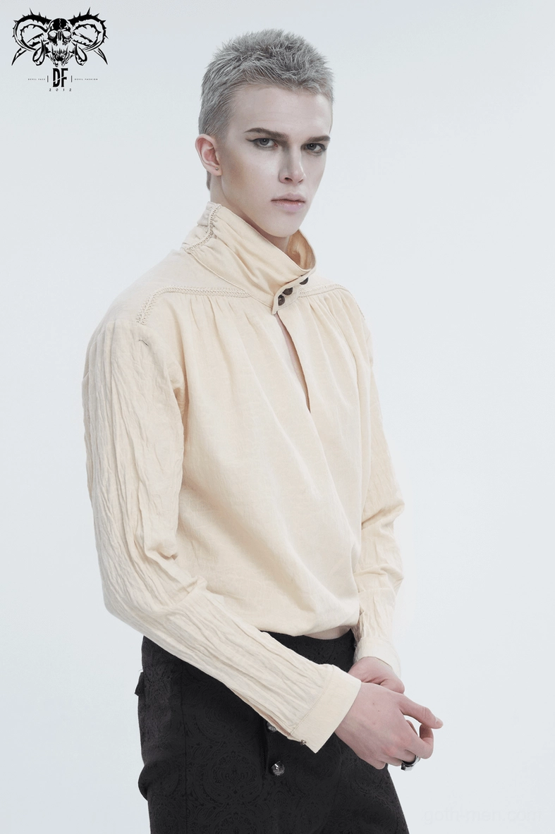 Vintage beige shirt mannequin display, emphasizing the embroidered trim work and loose silhouette of the gothic design