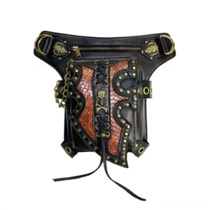 Flat lay product shot of gothic waist bag showing antique brass hardware, zipper closure, chain details and lace trim