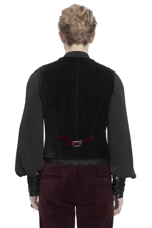 Men's gothic waistcoat back view showing adjustable buckle strap, wine red trousers, studio photography