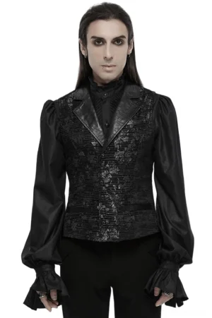 Black jacquard gothic waistcoat with gemstone buckle worn by male model in full-body front view, featuring ruffled cuffs and leather lapels