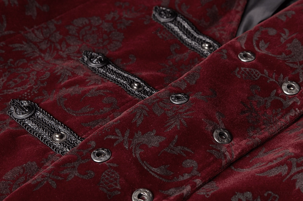 Angled close-up detail of gothic waistcoat showing intricate damask print and metal snap button construction