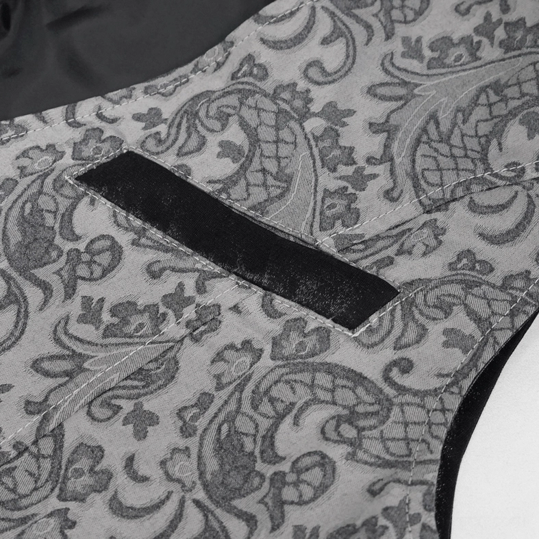 Close-up of fake breast pocket detail on men's gothic waistcoat showing faux suede and paisley fabric