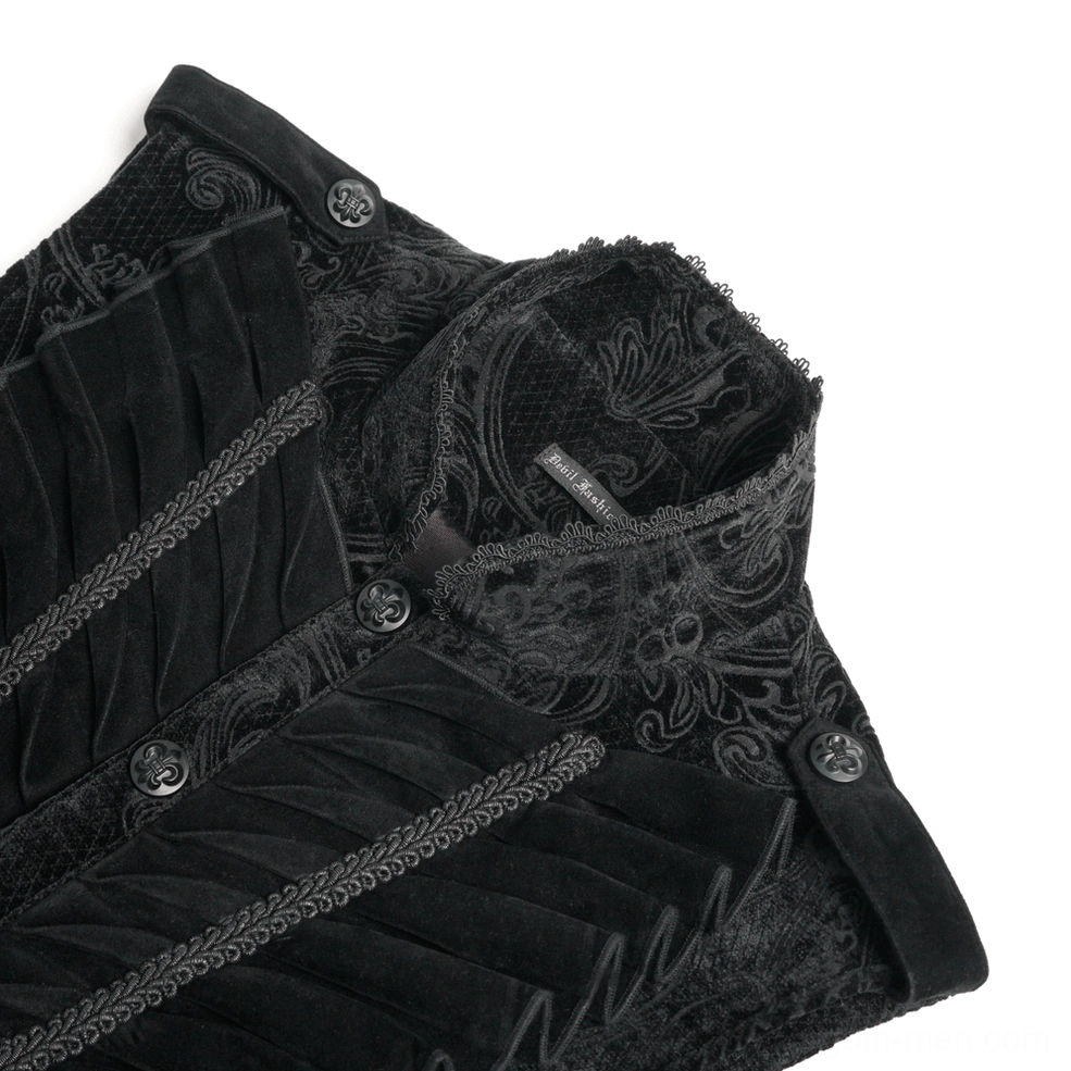 Close-up detail of gothic waistcoat velvet fabric, embroidered damask pattern, and branded decorative buttons