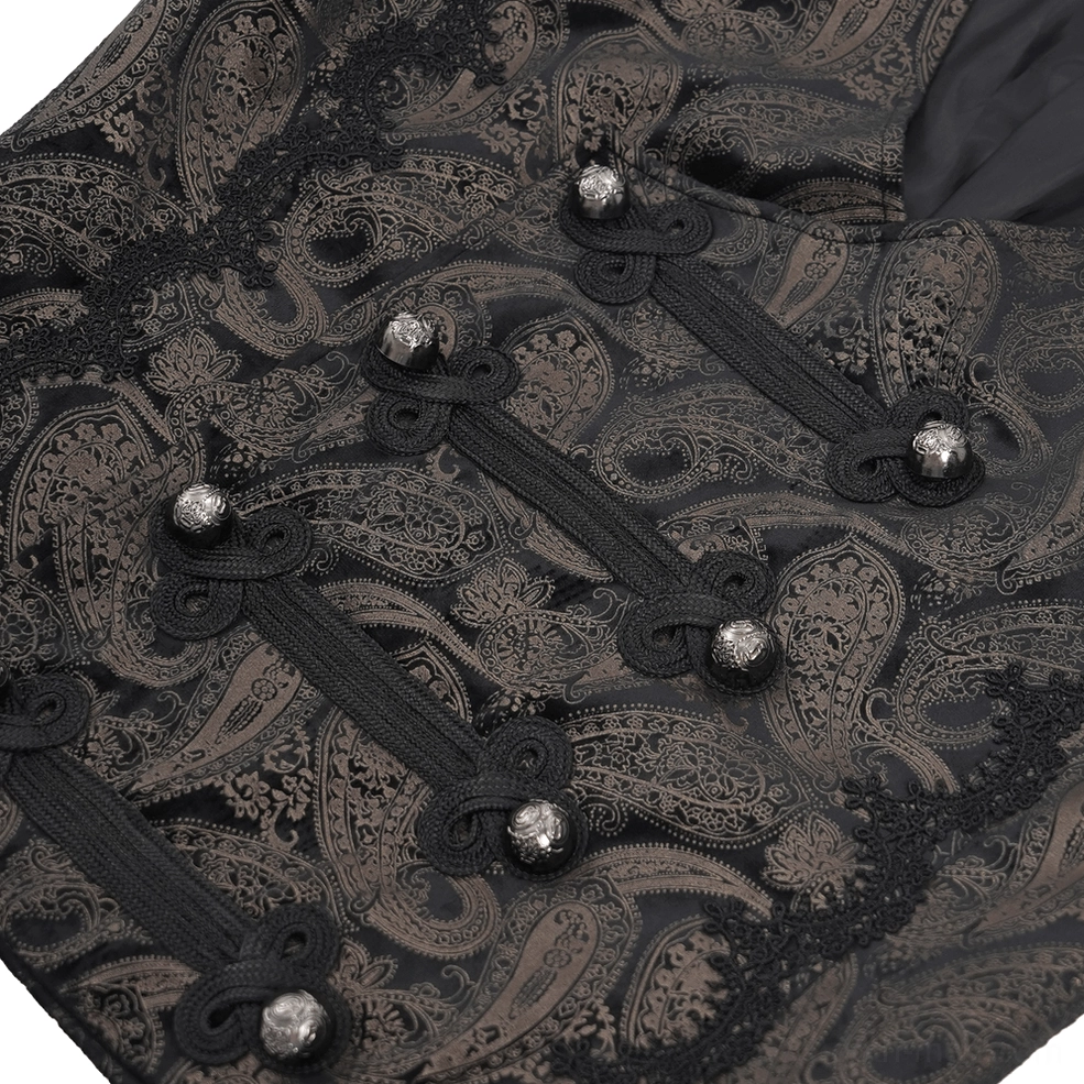 Detailed close-up of waistcoat fasteners showing black frog knots and silver metal dome buttons on paisley fabric