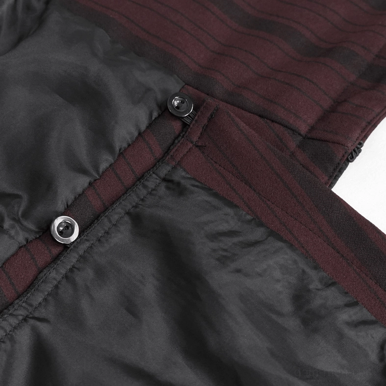 Interior detail of gothic waistcoat showing hidden metal button fastener and luxurious black satin lining