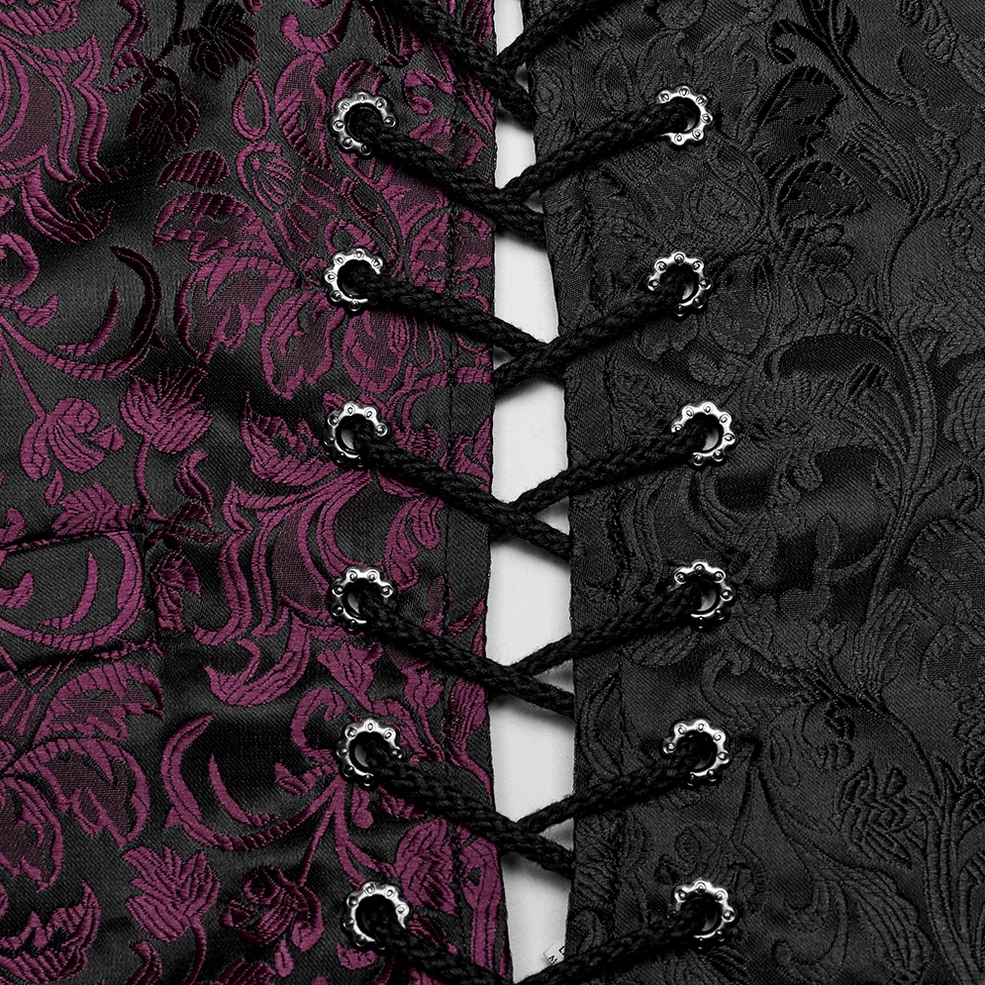 Close-up of braided black lace fasteners and ornate metal eyelets on waistcoat
