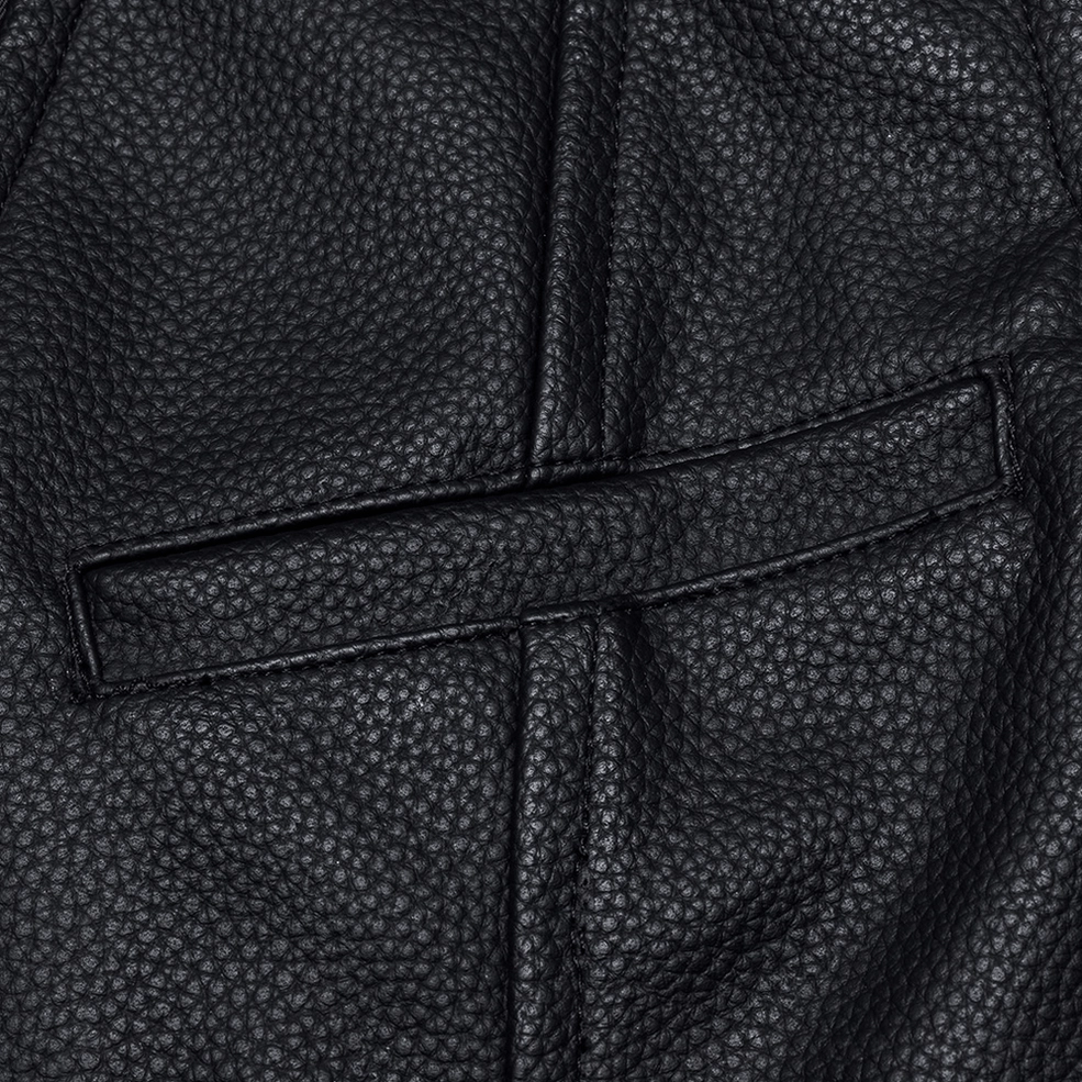 Black pebbled faux leather texture detail of gothic waistcoat showing material quality and craftsmanship
