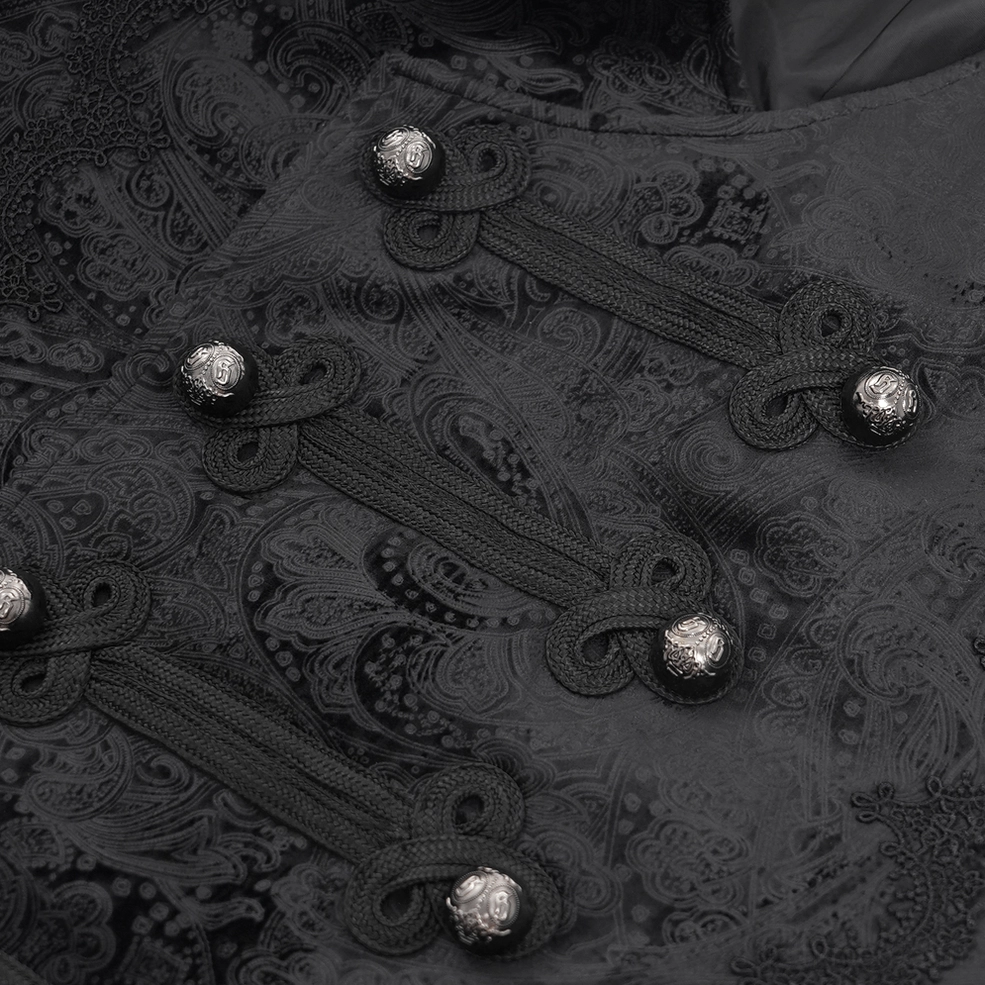 Close-up detail of black gothic waistcoat ornate metal frog buttons and dark paisley embroidered texture