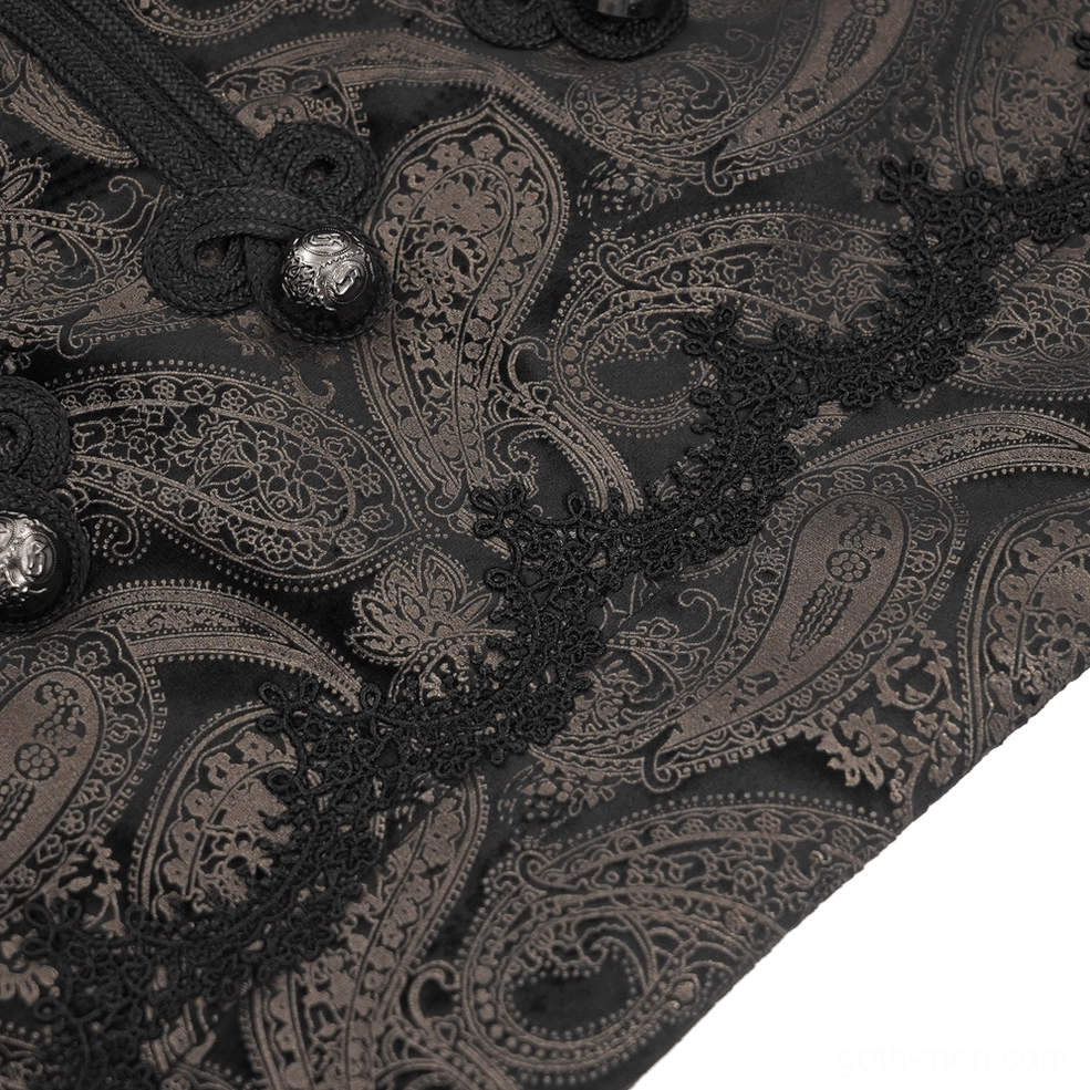Extreme close-up showcasing intricate paisley embroidery pattern with black lace trim and decorative metal button