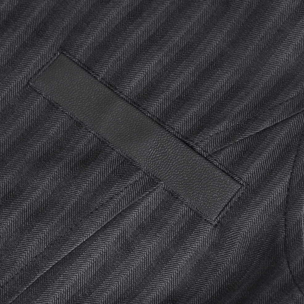 Black pinstriped gothic waistcoat showing pocket placement and fabric texture close-up