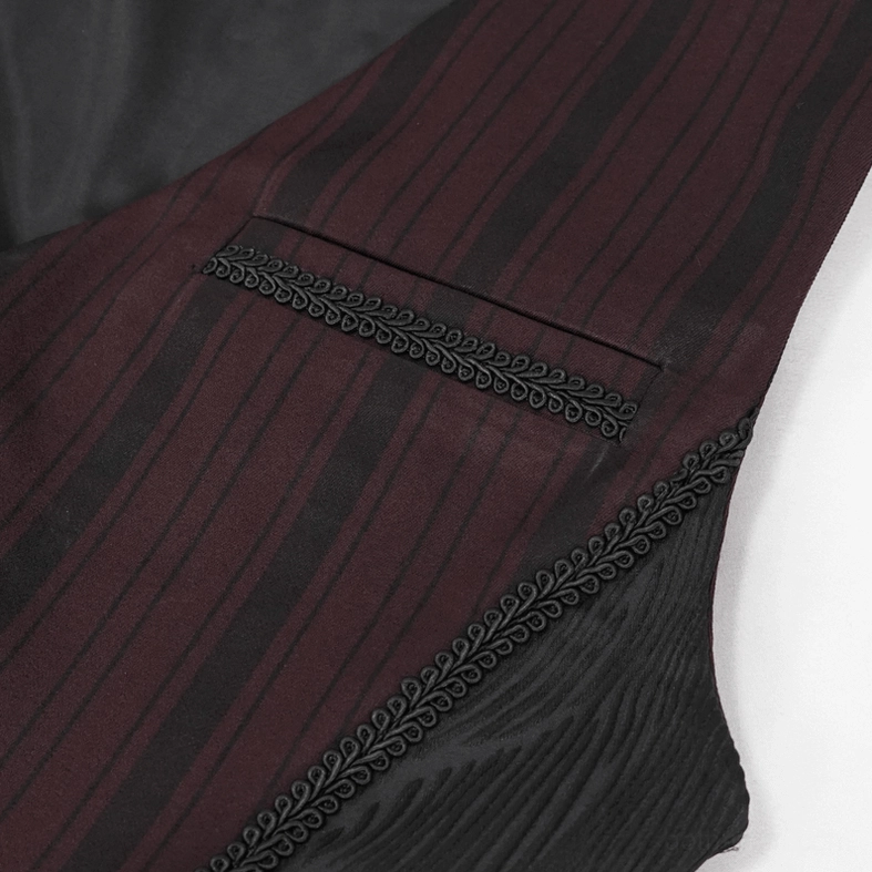 Detail shot of waistcoat pocket featuring embroidered braided decorative trim on burgundy stripe and black fabric