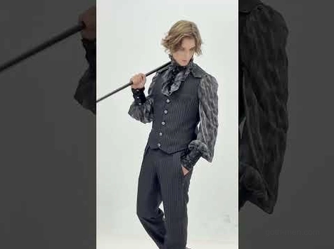 Black gothic pinstriped waistcoat three quarter view with cane accessory alternative fashion styling