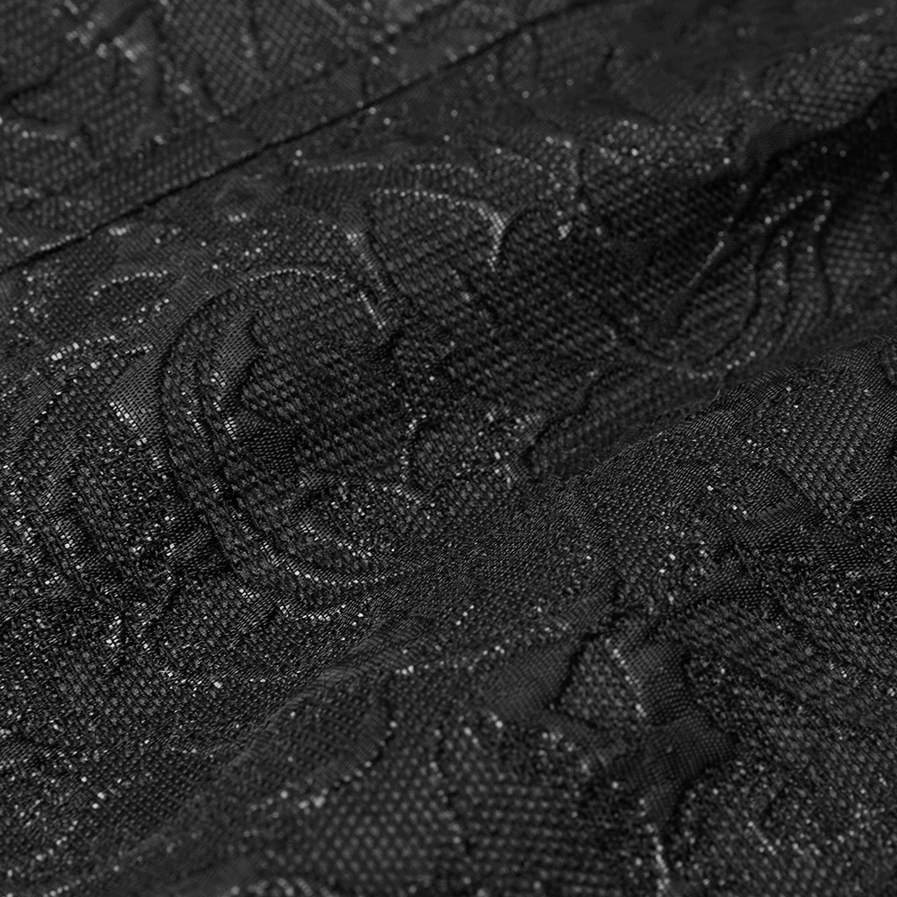Detailed view of red velvet panel with embossed black jacquard border on gothic waistcoat
