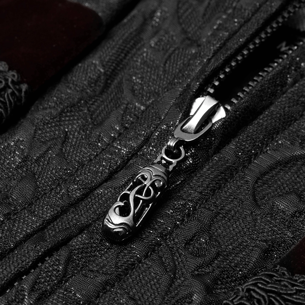 Macro photography of carved silver zipper pull on black jacquard gothic waistcoat
