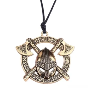 Gold-toned dark axe helmet gothic pendant with engraved runes, flat lay jewelry photography