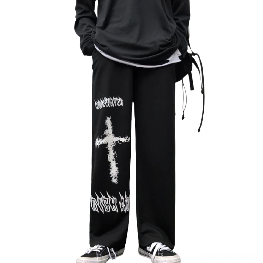 Black gothic wide leg pants with white graffiti cross print, front view on male model