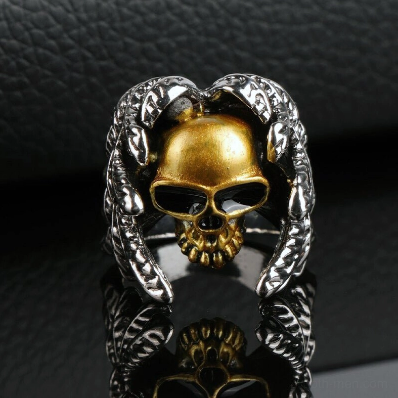 Gothic winged skull ring classic biker design on reflective black leather background showcasing statement jewelry piece