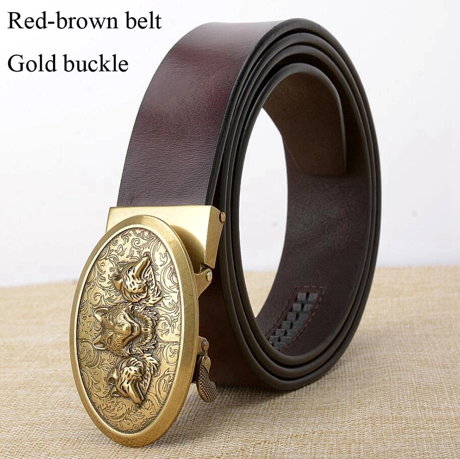Red-brown genuine leather gothic belt with gold wolf embossed buckle, styled on natural fabric background