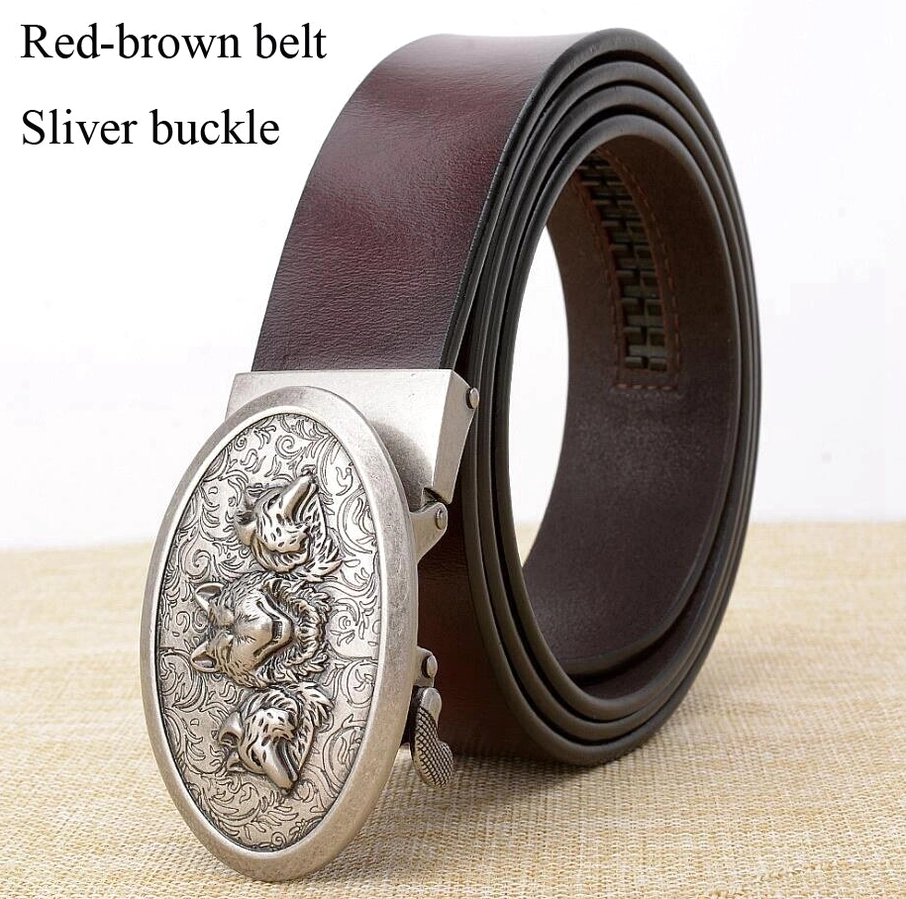 Red-brown cowhide leather gothic belt with silver wolf oval buckle, flat lay on textured linen surface