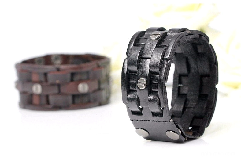 Black and coffee brown leather hand-woven gothic wrap bracelets, flat lay side view with soft white floral background