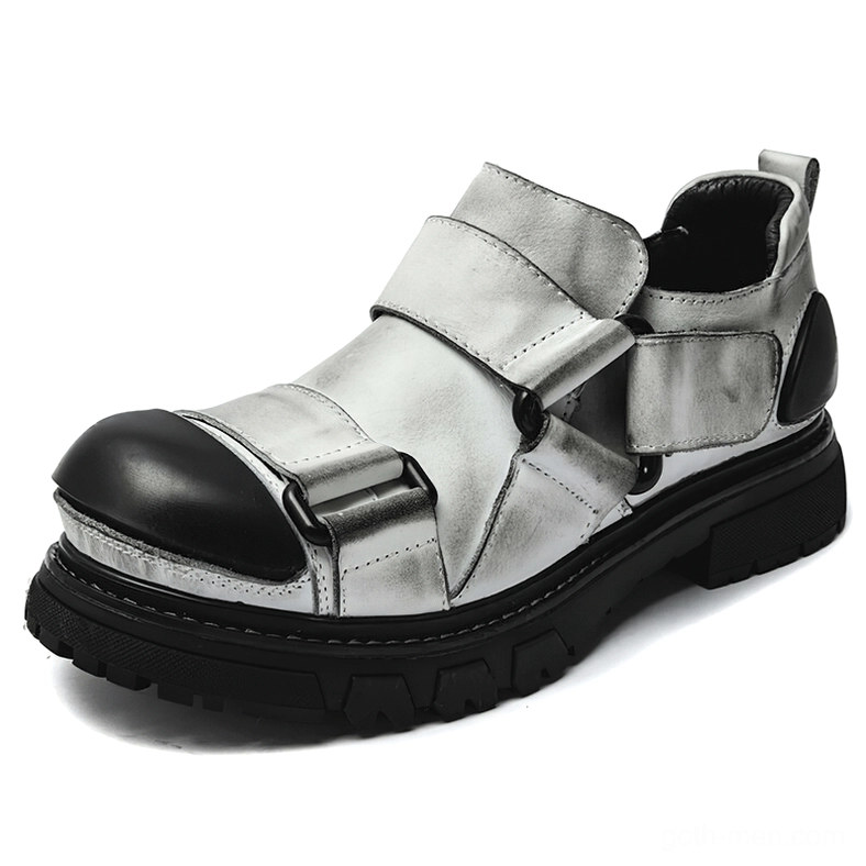Two-tone gray gothic punk leather loafers with black toe cap, velcro straps, and thick black lug sole, front view