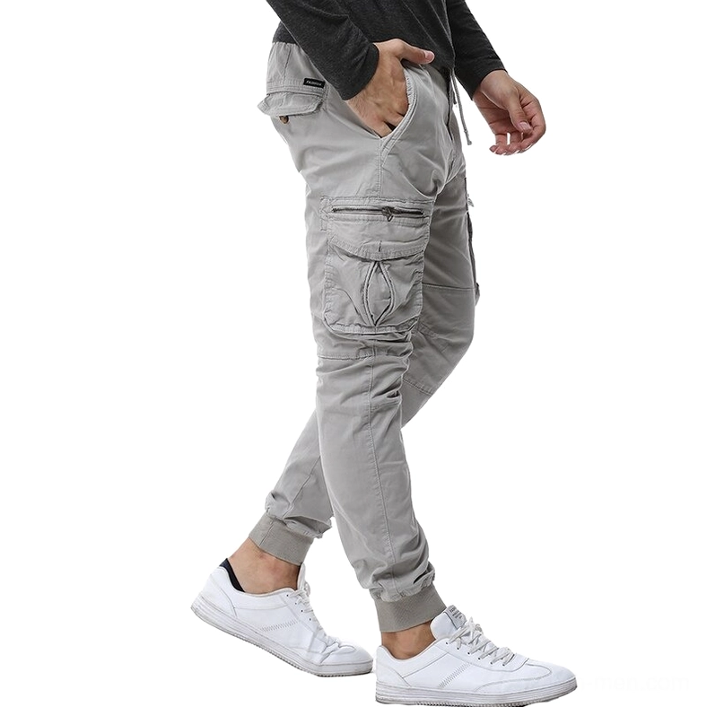 Gray gothic cargo pants side view with zippered pockets and tapered ribbed cuffs