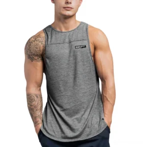 Gray alternative tank top for men with loose fit on tattooed model