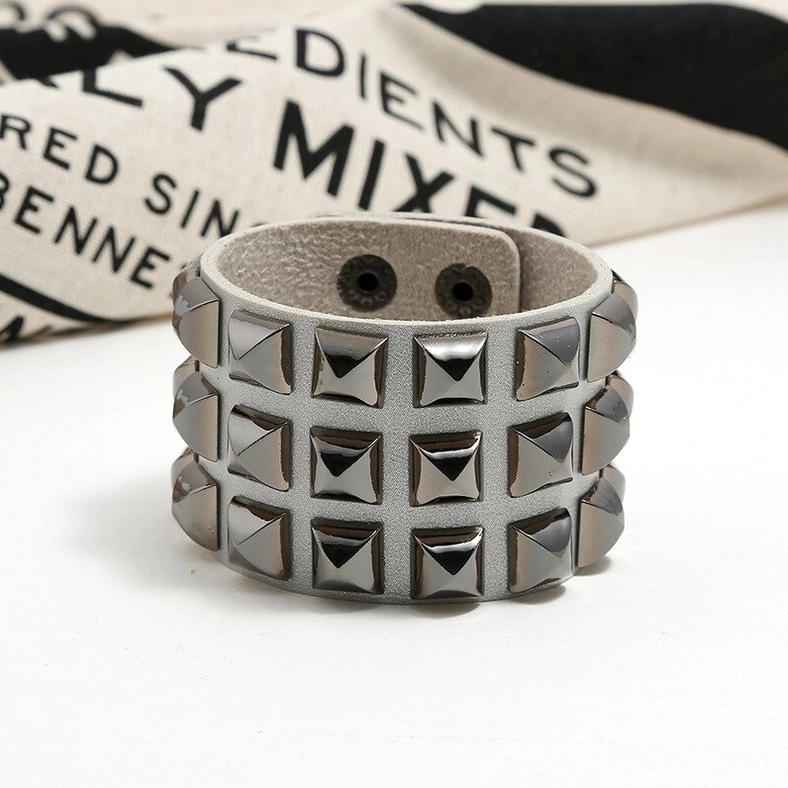 Light gray studded leather gothic cuff bracelet with triple pyramid stud rows - front view