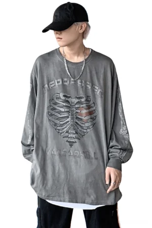 Gray faded skeleton heart gothic pullover on model displaying front-facing aesthetic and washed fabric texture