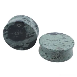 Green eye stone gothic ear gauges in various sizes displayed together showing natural black veining and marbled patterns
