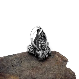Grim Reaper biker gothic skull ring three-quarter side view aged silver finish on brown stone