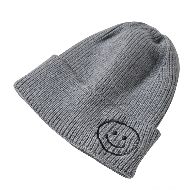 Heather gray knit beanie with dark gray smiley face embroidery, neutral gothic style