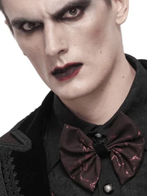 Gothic lace-up bow tie on male model styled with formal alternative wear and dark aesthetic makeup