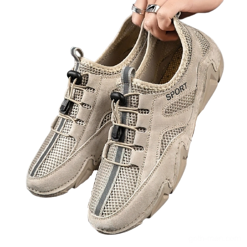 Pair of khaki gothic alternative sneakers with toggle laces and mesh inserts - frontal view