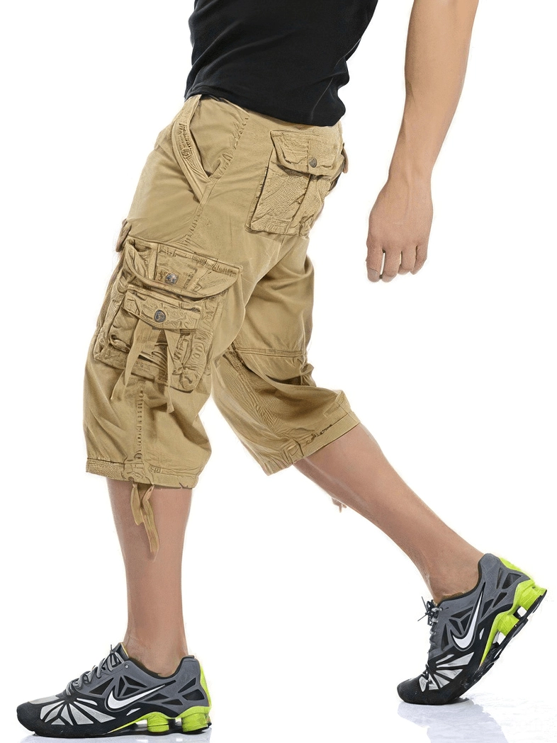 Khaki gothic cargo shorts side view walking pose - drawstring hem and multi-pocket tactical design