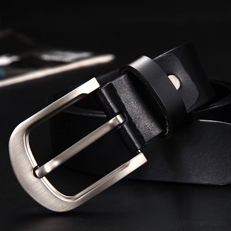 Black genuine leather belt overhead detail showing silver pin buckle with metal rivet construction