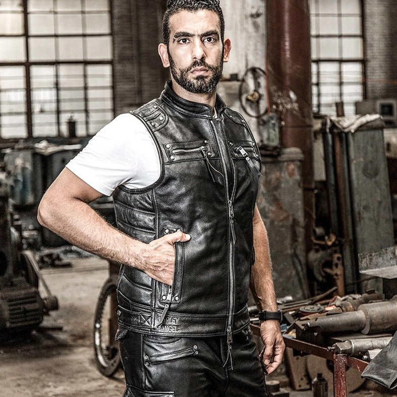 Model showcasing black leather biker vest with alternative goth fashion accessories