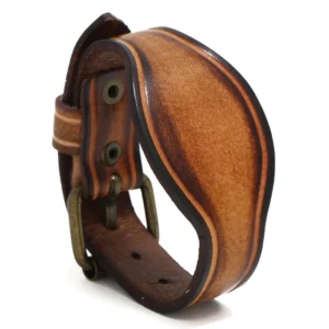 Punk style leather bangle with antique brass buckle and adjustable strap - front close-up detail view