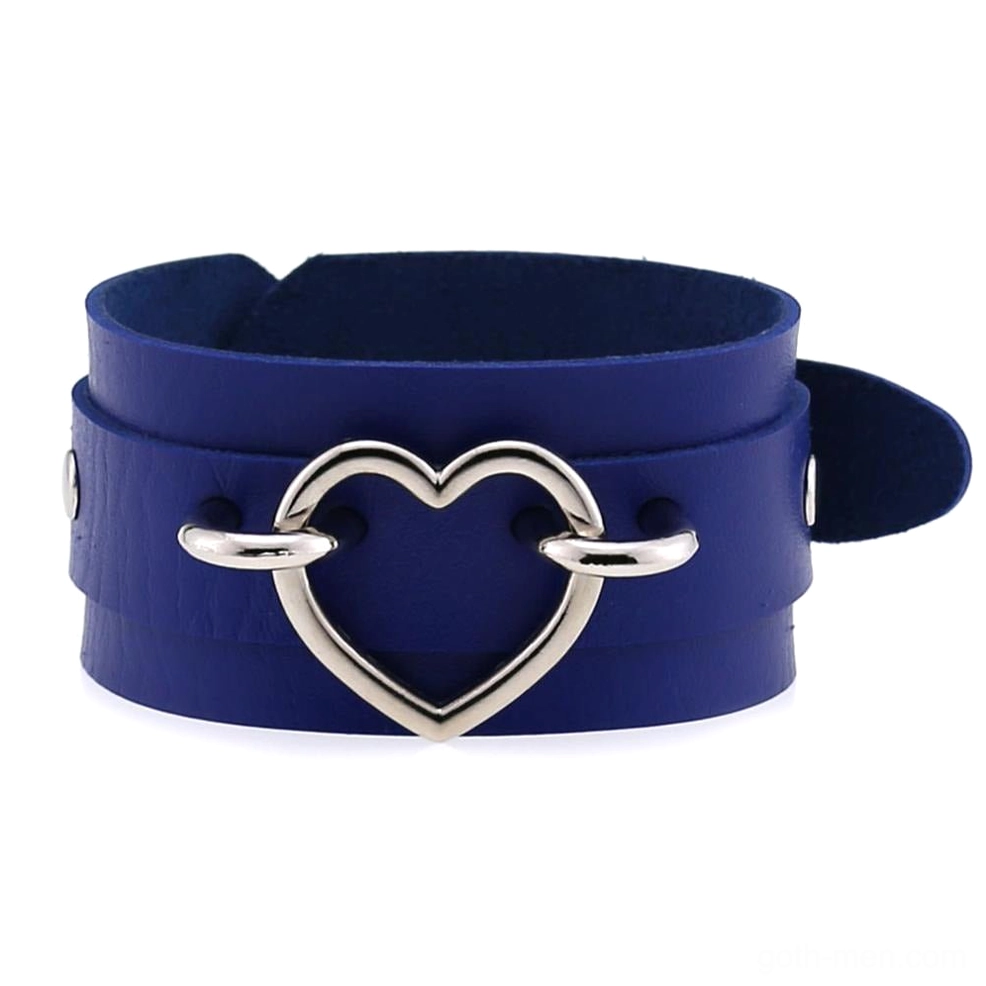 Leather heart cuff bracelet detail shot showing silver hollow heart buckle construction and double-layer leather composition