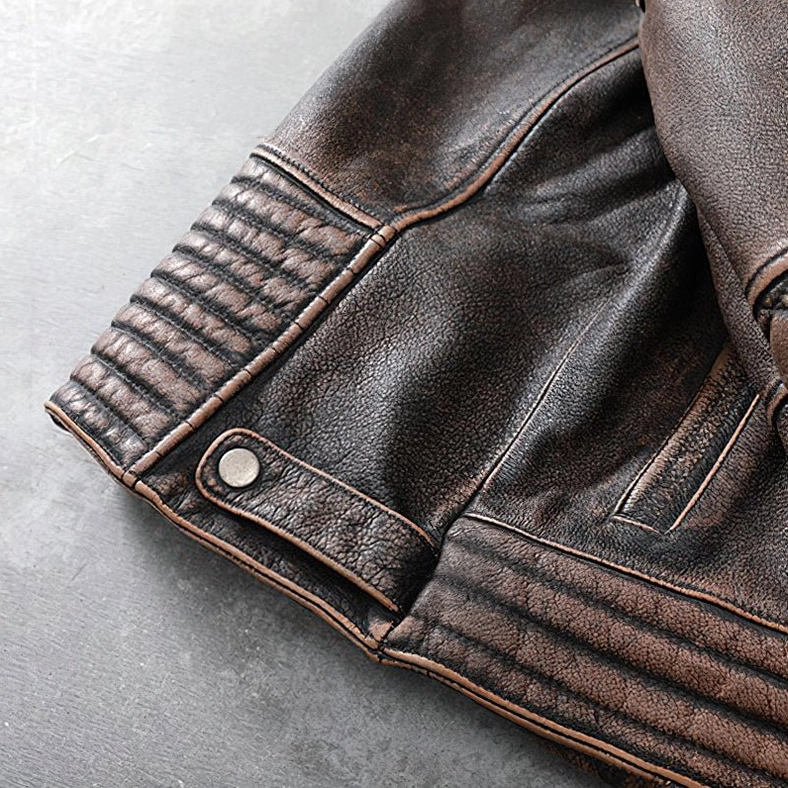 Gothic motorcycle jacket leather craftsmanship detail showing stitching quality and texture of genuine cowhide