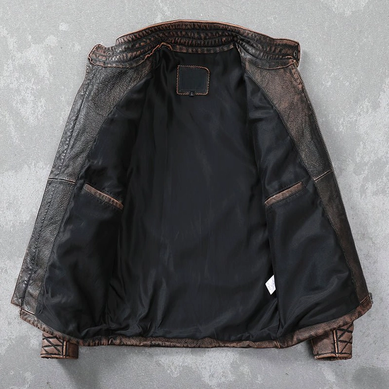 Premium black satin lining interior of distressed leather biker jacket with internal pockets and neck label