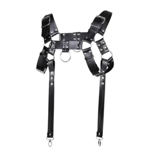 Black PU leather metal rivet chest harness flat lay front view with adjustable straps and dual center rings, gothic bondage suspenders for men