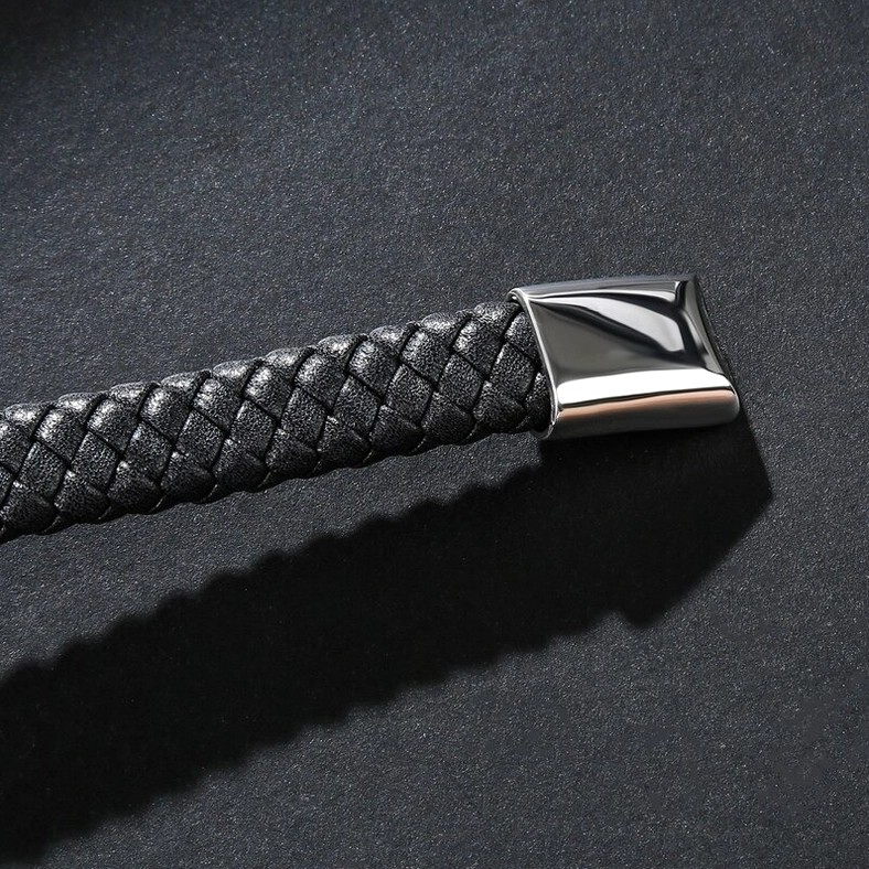 Black genuine leather skull bracelet with stainless steel magnetic clasp, close-up detail of gothic craftsmanship