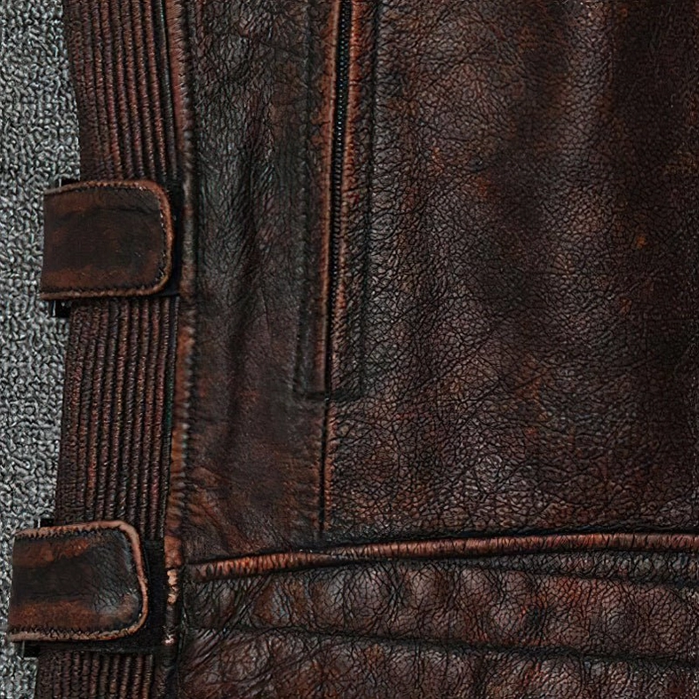 Vintage brown genuine leather biker vest side view showing slim fit construction